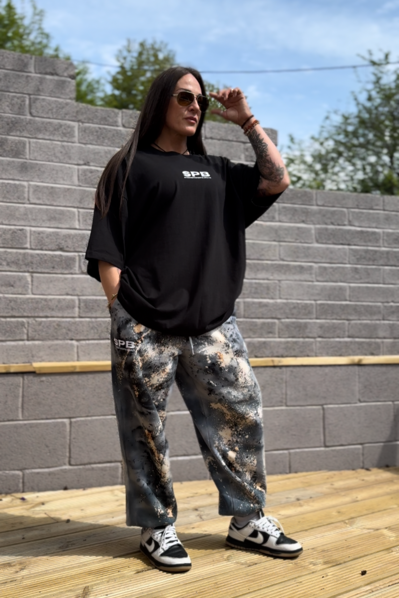 The idea T-shirt worn in a size 2XL in black with the cosmic black oversized bottoms
