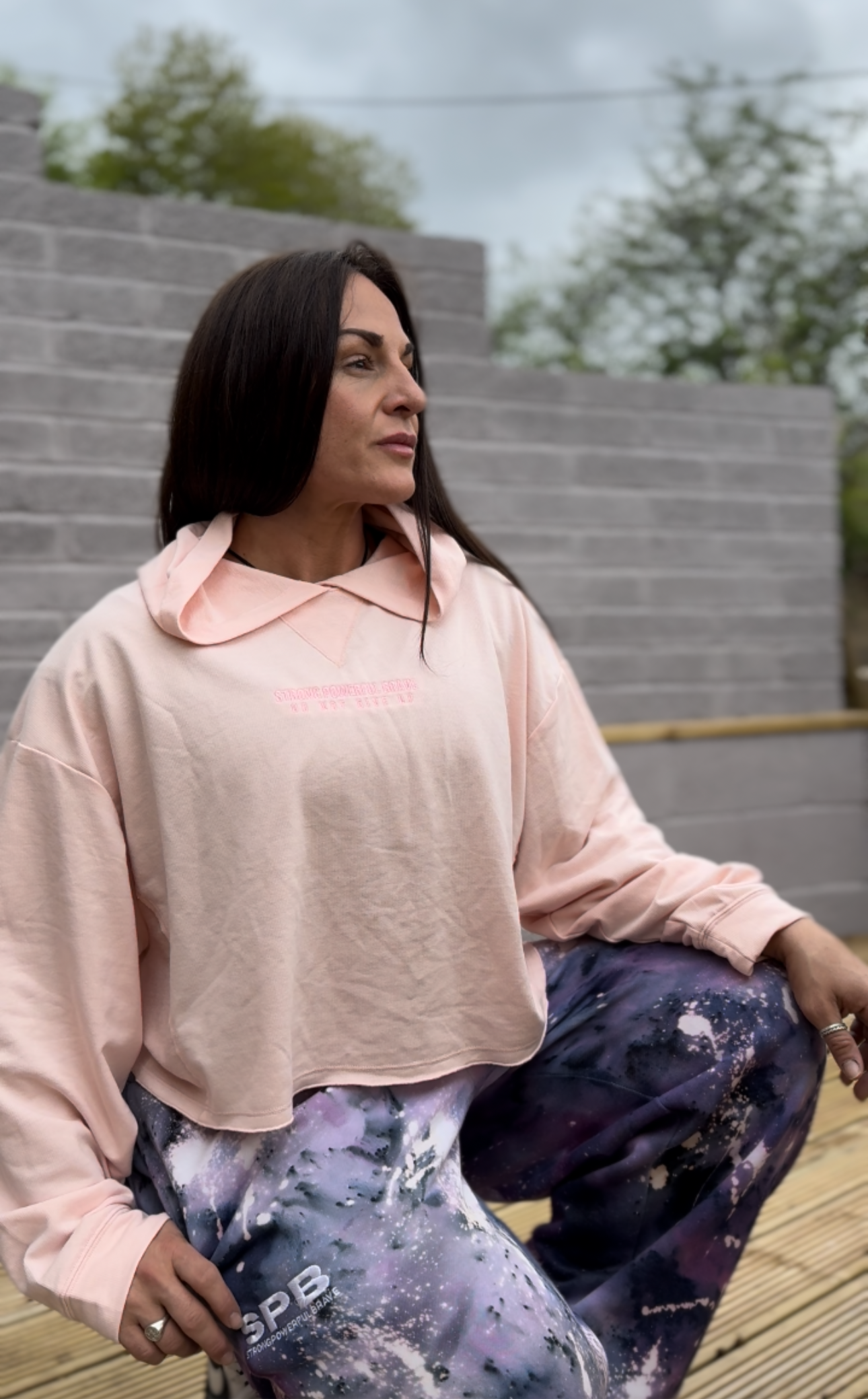 Wearing SPB cropped pink hoodie, and cosmic purple joggers 