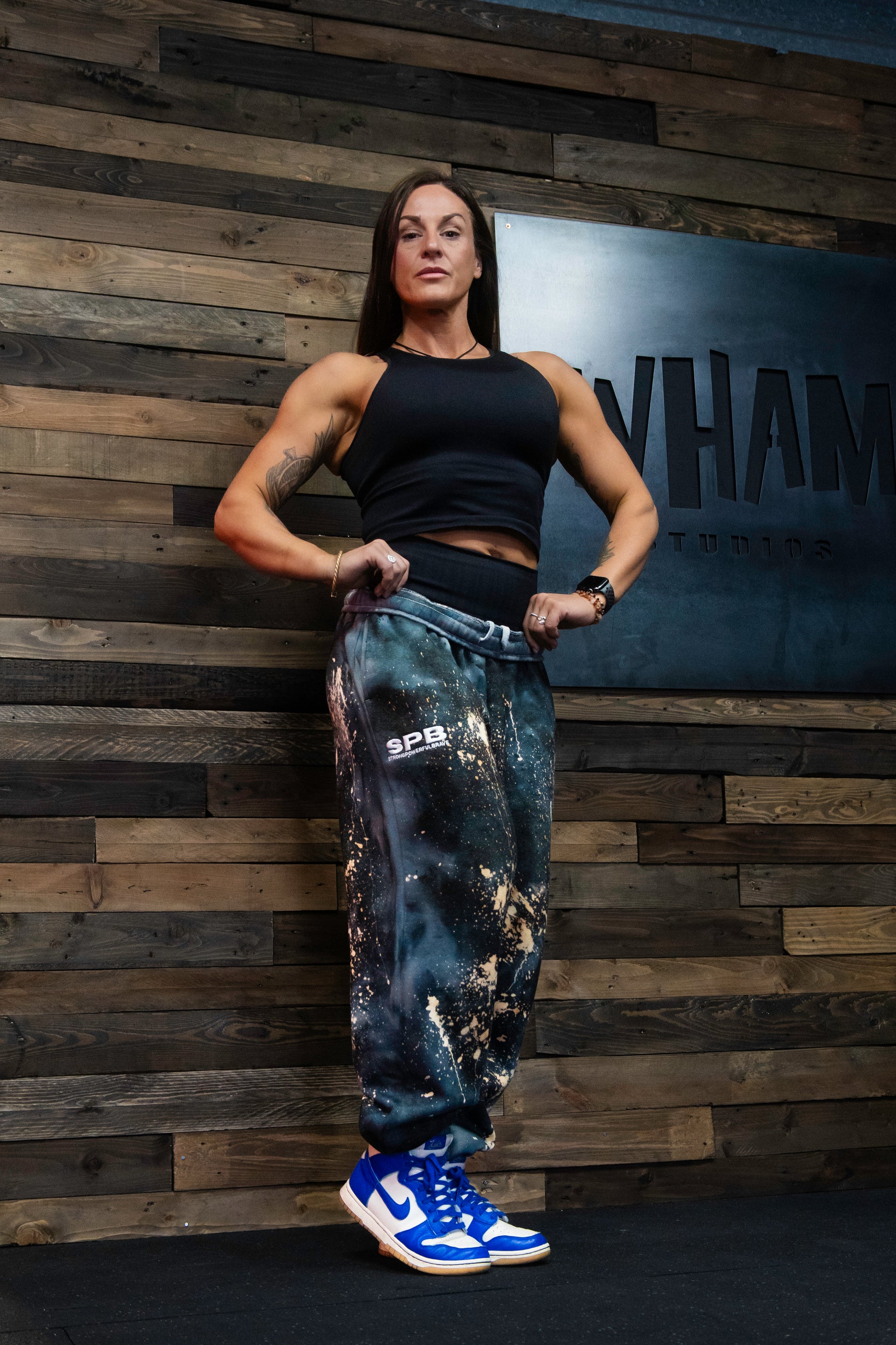 Founder Carly wearing the Super cosmic black oversized tie dye bottoms in an XL 