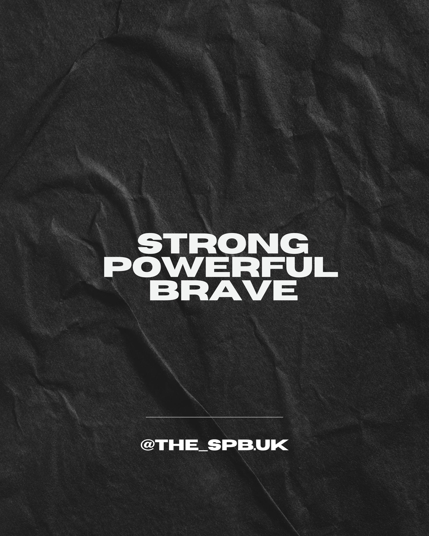 Black fabric with white text 'Strong Powerful Brave' and a social media handle.